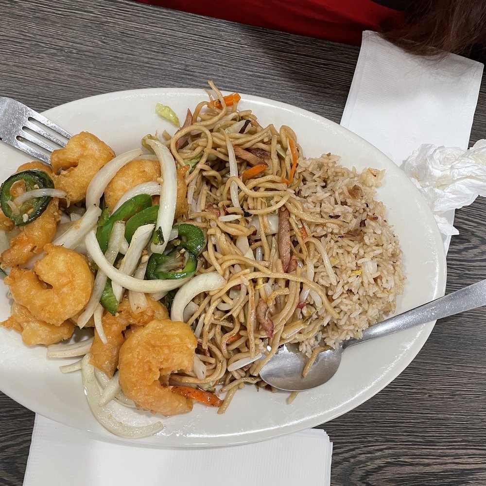New China Restaurant - a plate of food on a table - Chinese Near Me - Delano, California New China Restaurant - a plate of food on a table - Chinese Near Me - Delano, California