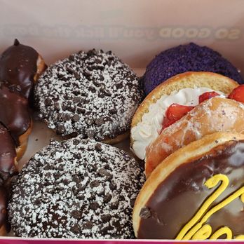 Pinkbox Doughnuts - Vegas chocolate Bavarian, strawberry shortcake, purple rain (ube), chocolate marscapone and the dirty twist (triple chocolate twist). - Donuts Near Me - Primm, Nevada Pinkbox Doughnuts - Vegas chocolate Bavarian, strawberry shortcake, purple rain (ube), chocolate marscapone and the dirty twist (triple chocolate twist). - Donuts Near Me - Primm, Nevada