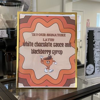 Coastline Coffee Company - a sign for the white chocolate sauce and blackberry syrup - Coffee & Tea Near Me - Delaware, Ohio