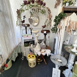 Rose's Recollections - Iron trellis arch, birdbaths, everything to enhance your spring garden.