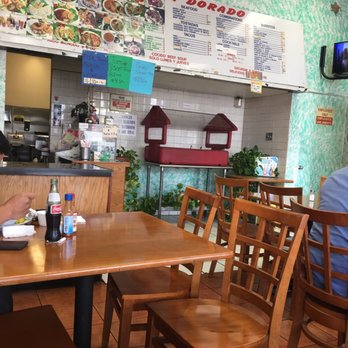 Taqueria Dorado - a man sitting at a table - Mexican Near Me - Bellflower, California Taqueria Dorado - a man sitting at a table - Mexican Near Me - Bellflower, California