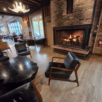 Buffalo Rose - The cozy fireplace near the entryway is perfect place for a couple or small group. - Bars Near Me - Golden, Colorado