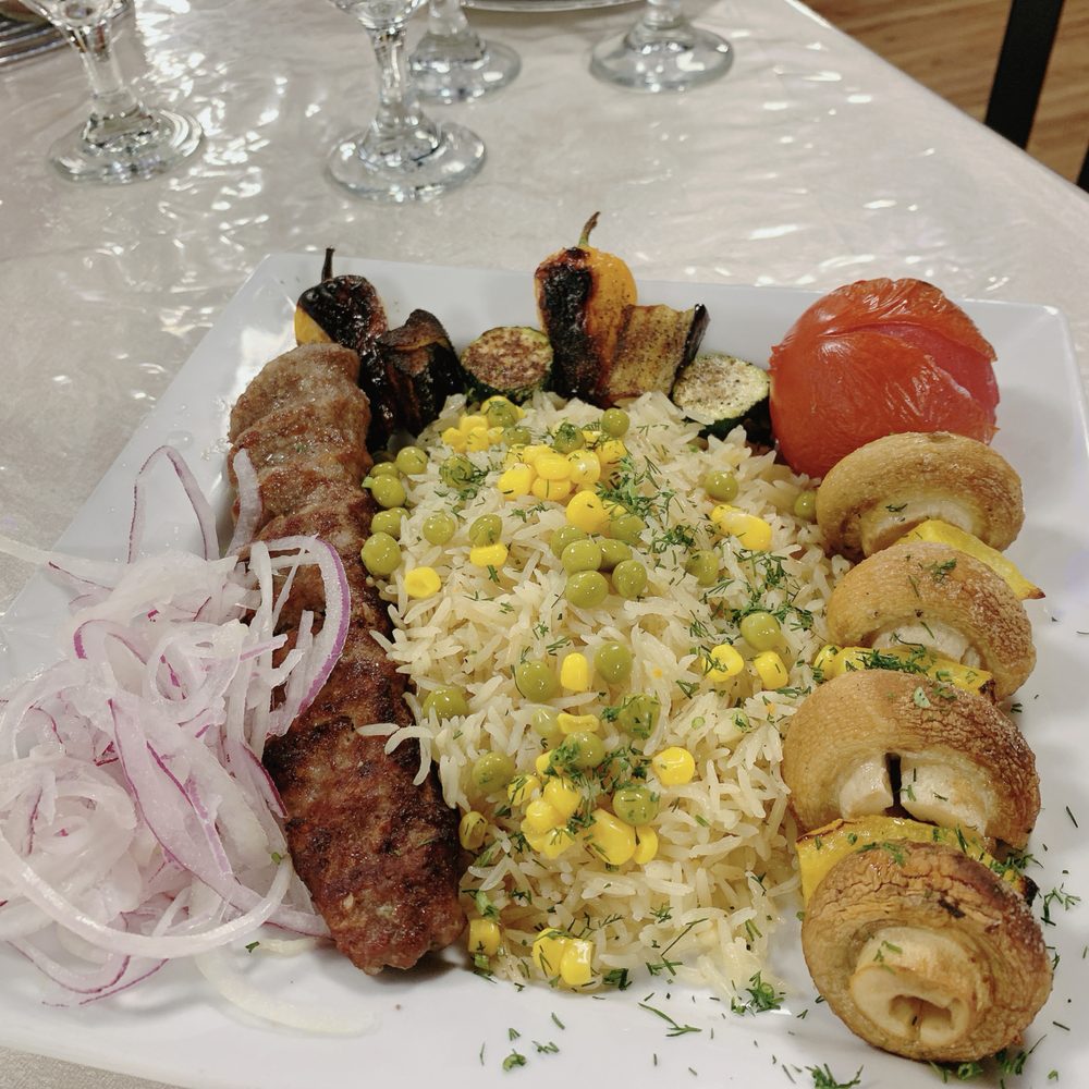 Mirage Mediterranean - a plate of food on a table - Mediterranean Near Me - Cincinnati, Ohio