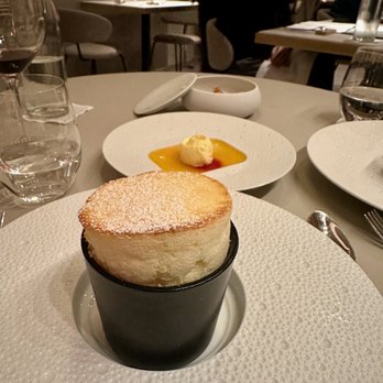 Essential by Christophe - Soufflé Chaud (orange rum, green cardamom ice cream - $15) - French Near Me - New York, New York