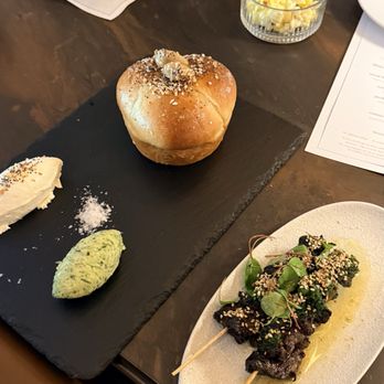 AVANT Restaurant - Parker House roll with seasonal butter, Woodfired Waggy beef steers and popcorn. - New American Near Me - San Diego, California AVANT Restaurant - Parker House roll with seasonal butter, Woodfired Waggy beef steers and popcorn. - New American Near Me - San Diego, California