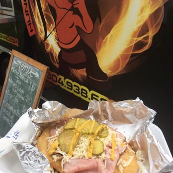 Hungry Hungry Arrow - a person holding a hot dog - Food Trucks Near Me Hungry Hungry Arrow - a person holding a hot dog - Food Trucks Near Me