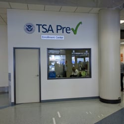 TSA Pre Enrollment Center Terminal 1 - Small interior. A bit warm inside. Checkin with staff first at the small podium.