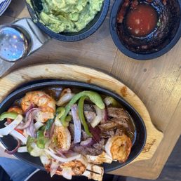 Sizzling fajitas an empty red salasa Sizzling fajitas an empty red salasa