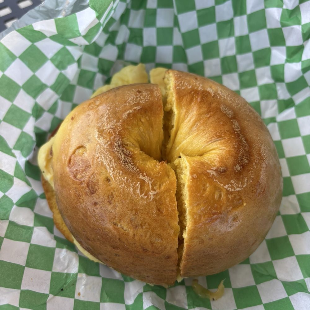 Homesick Bagels - Egg bagel with roasted garlic sage butter, egg, & Gouda - Coffee & Tea Near Me - Tampa, Florida Homesick Bagels - Egg bagel with roasted garlic sage butter, egg, & Gouda - Coffee & Tea Near Me - Tampa, Florida