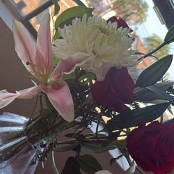 Green Hills Florist - you can see some petals off both the lily's were ripped off.
