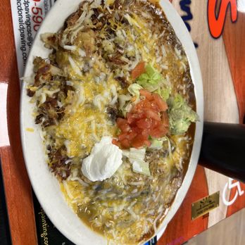Doug's Breakfast Lunch - Stacked chicken enchiladas - Breakfast & Brunch Near Me - Colorado Springs, Colorado Doug's Breakfast Lunch - Stacked chicken enchiladas - Breakfast & Brunch Near Me - Colorado Springs, Colorado