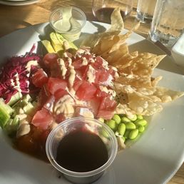 This is the poke bowl. It's is artfully presented and as good as it looks. I ordered mine with wasabi and soy sauce for extra tang.