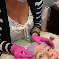 Robert & Robert Hair Designers - Ashley - making measurement marks at the start of the Microblading process.