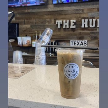 The Healthy Hub - a cup of coffee on a counter - Juice Bars & Smoothies Near Me - Murphy, Texas