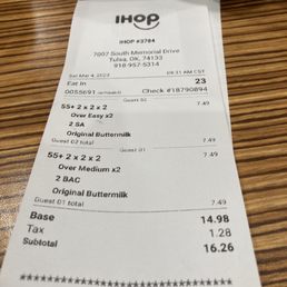 a receipt on a table with a cup of coffee a receipt on a table with a cup of coffee