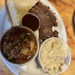 Wild West BBQ & Restaurant - Sliced beef plate with mashed potatoes and spicy beans with Texas toast.