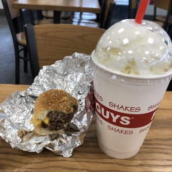 Five Guys - a hamburger and a drink on a table - Burgers Near Me - Ithaca, New York