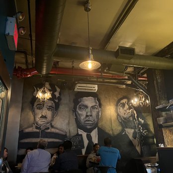 Charlies Bar & Kitchen - Their wall - Cocktail Bars Near Me - Bronx, New York
