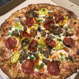 Pepperoni, sausage, banana peppers, green peppers and mushroom... splashed of hot sauces, garlic, oregano and crushed red pepper