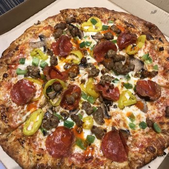 Pizza Studio - Pepperoni, sausage, banana peppers, green peppers and mushroom... splashed of hot sauces, garlic, oregano and crushed red pepper - Pizza Near Me - East New York, New York
