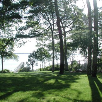 G Bourne Knowles - a grassy area with trees and a lake in the background - Landscaping Near Me - Fairhaven, Massachusetts G Bourne Knowles - a grassy area with trees and a lake in the background - Landscaping Near Me - Fairhaven, Massachusetts