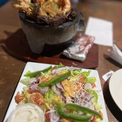 Luchador Bar & Eats - Molcajete and I substituted it with a salad instead of the rice and beans.