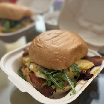 Egghill - The Mustache (Two Cage-free Eggs, Gifford's Bacon, Fontal Cheese, Caramelized Onion Jam, House Dijonaise & Arugula on Warm Charpier Bun) - Breakfast & Brunch Near Me - Nashville, Tennessee Egghill - The Mustache (Two Cage-free Eggs, Gifford's Bacon, Fontal Cheese, Caramelized Onion Jam, House Dijonaise & Arugula on Warm Charpier Bun) - Breakfast & Brunch Near Me - Nashville, Tennessee