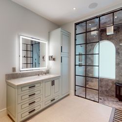 Master bath steam shower with rain heads and waterfall