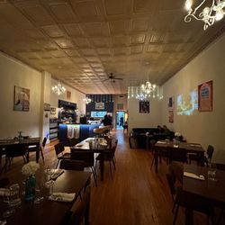 Trattoria Rossi - The interior, they had Italian music playing and a Sophia Loren movie projected onto the wall.