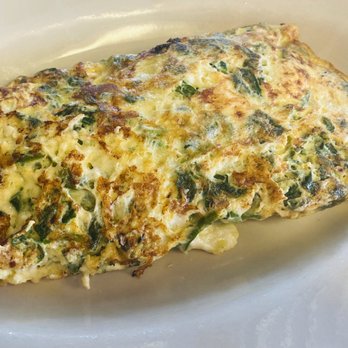 Tin Can Cafe - an omelet on a white plate - Cafes Near Me - Clearwater, Florida Tin Can Cafe - an omelet on a white plate - Cafes Near Me - Clearwater, Florida