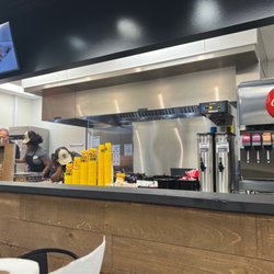 Dickey's Barbecue Pit - The grill, counter, open kitchen and drink stand.