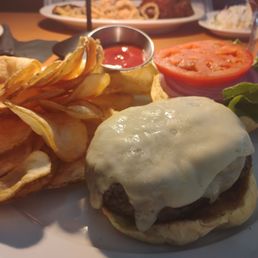 10oz Angus Burger with Swiss cheese and homemade chips on a challah roll 10oz Angus Burger with Swiss cheese and homemade chips on a challah roll