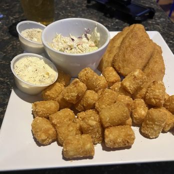 Icons Sports Grill - Here is my fish dinner and the burnt sliders that everything was burnt. The buns, onions and the thin hamburger patties. - American Near Me - Gilbert, Arizona Icons Sports Grill - Here is my fish dinner and the burnt sliders that everything was burnt. The buns, onions and the thin hamburger patties. - American Near Me - Gilbert, Arizona