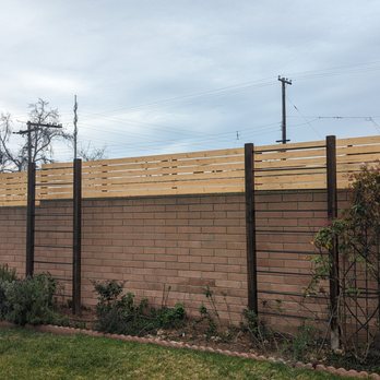 DCC Construction - New fence privacy topper integrated seamlessly into existing brick wall - Masonry/Concrete Near Me - National City, California