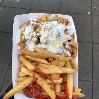 Athena's - a person holding a container of fries and ketchup - Greek Near Me - Seattle, Washington Athena's - a person holding a container of fries and ketchup - Greek Near Me - Seattle, Washington