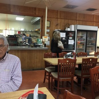 Fish Hut - a man sitting at a table in a restaurant - Seafood Near Me - Savannah, Tennessee
