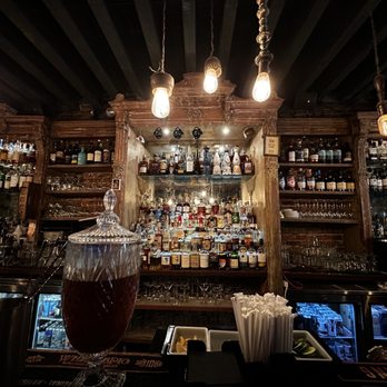 Independence Bar - a tall glass filled with liquid - Bars Near Me - New York, New York Independence Bar - a tall glass filled with liquid - Bars Near Me - New York, New York