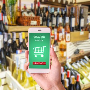 Copperfield's Market - a hand holding a phone displaying a grocery online - Grocery Near Me - Chicago, Illinois