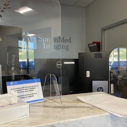 SimonMed Imaging - Copperpoint - Check-in desk - wall of computers blocking communication with patients