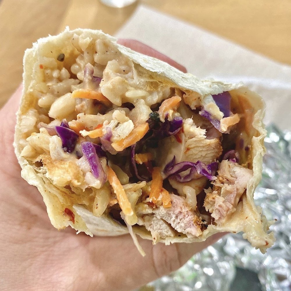 High Tech Burrito - Blackhawk - a hand holding a burrito - Mexican Near Me - Danville, California