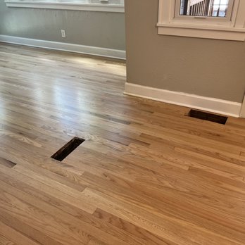 The Flooring Artists - A spot that originally had yellowing wood and mismatched wood types. - Flooring Near Me