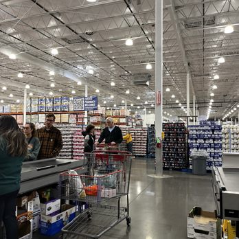 Costco Wholesale - Customers are shopping inside Costco Wholesale, with shelves of products and a checkout area visible. The store has high ceilings with bright lighting. - Gas Stations Near Me - Albuquerque, New Mexico
