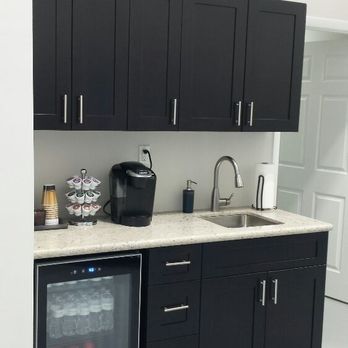 Dantes Construction - a kitchen with black cabinets - General Contractors Near Me - Miami Beach, Florida Dantes Construction - a kitchen with black cabinets - General Contractors Near Me - Miami Beach, Florida