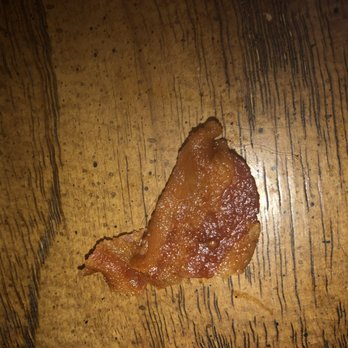 Burger King - a piece of bacon on a wooden table - Burgers Near Me - Bonney Lake, Washington