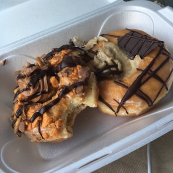 Mojo Donuts - To the left, the buttefinger donut. To the right is the tiramisu. They looked much neater when he boxed them for me, don't mind the mess (: - Donuts Near Me - Pembroke Pines, Florida