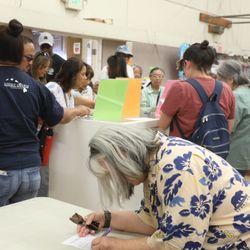 Southern Alameda County Buddhist Church - Order Forms were on the counter where the orange and green signs are. People stood there to fill our their orders.