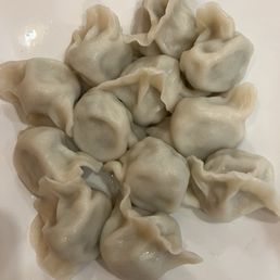 Three Meats Dumplings, actually stuffed with pork and chives Three Meats Dumplings, actually stuffed with pork and chives
