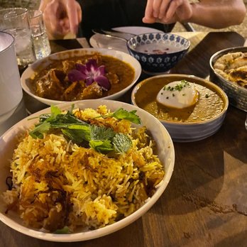 Daru - Wild mushroom biriyani in front of chicken tikka masala and black daal burrata. - Cocktail Bars Near Me - Washington, DC, District of Columbia Daru - Wild mushroom biriyani in front of chicken tikka masala and black daal burrata. - Cocktail Bars Near Me - Washington, DC, District of Columbia