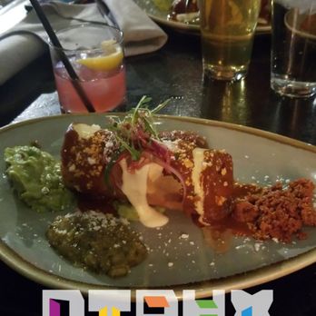 Chico Malo - Chicken chimichanga with alebrije drink in back - Mexican Near Me - Phoenix, Arizona Chico Malo - Chicken chimichanga with alebrije drink in back - Mexican Near Me - Phoenix, Arizona