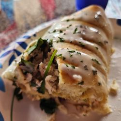 Flavors Eatery - Spinach, Artichoke, Chicken Burrito with garlic aoli on top.